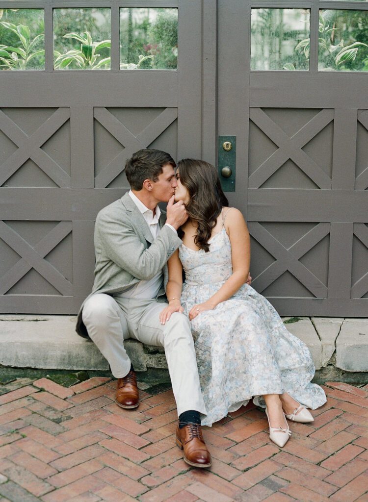 couple kissing in doorway