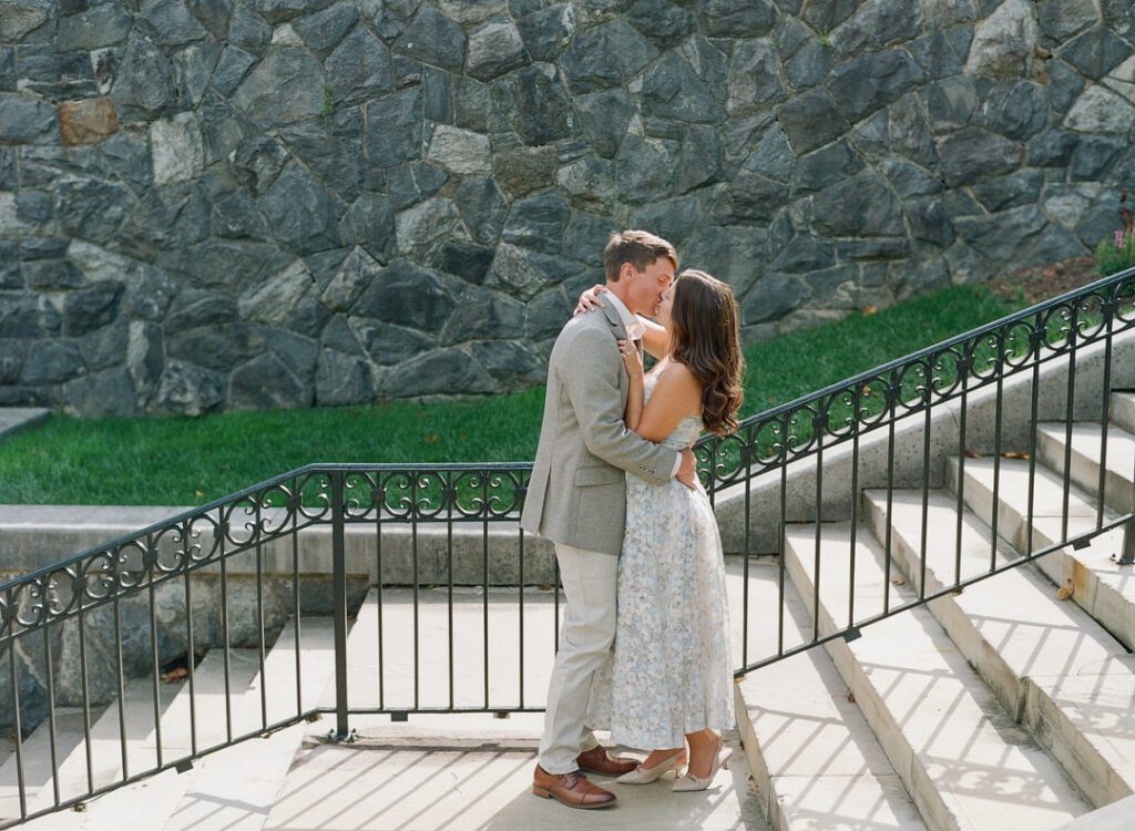 Couple kissing on stairs