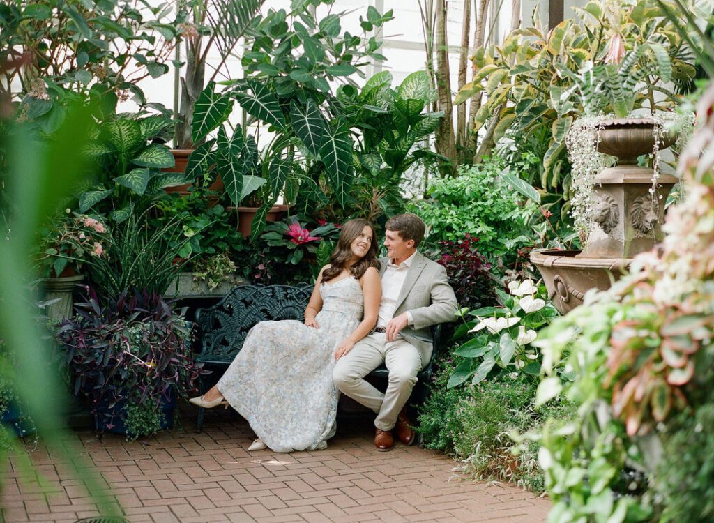 Biltmore Estate Images of couple sitting on bench in conservatory