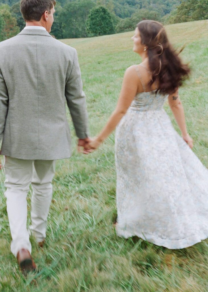 couple holding hands walking