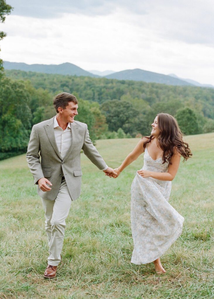 Couple running holding hands