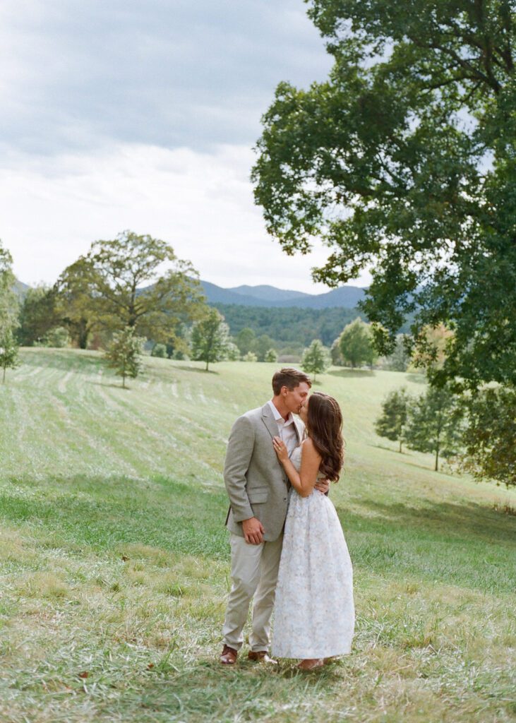 Couple kissing in field