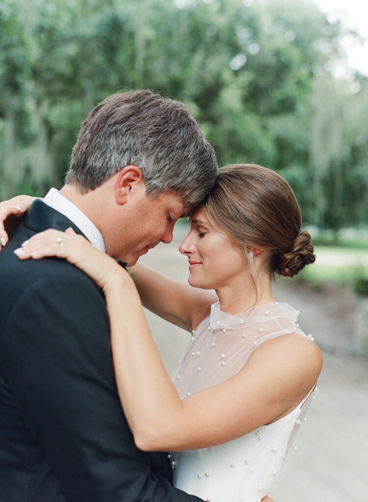 bride and groom hugging 