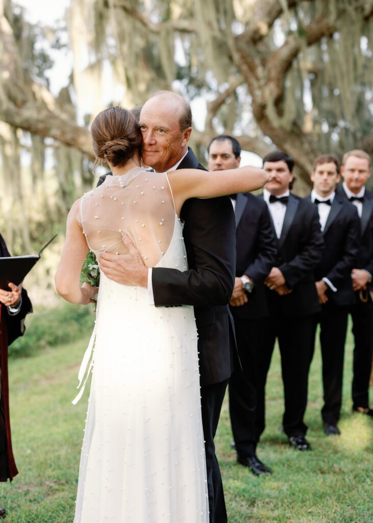 Father of Bride hugging bride 