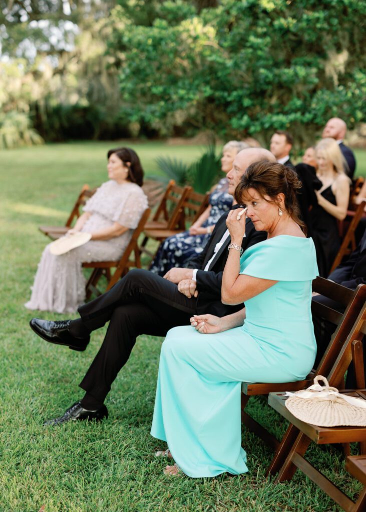 mother of bride drying tears 