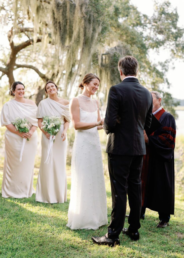 bride laughing during wedding ceremony 