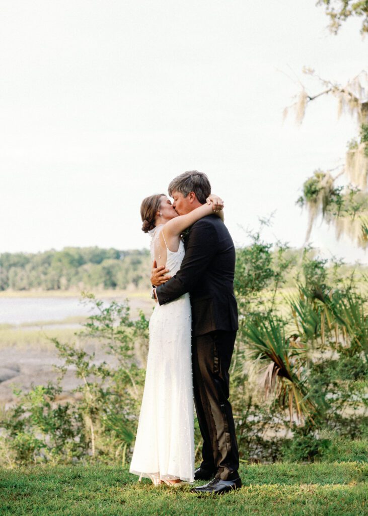 bride and groom wedding ceremony first kiss 