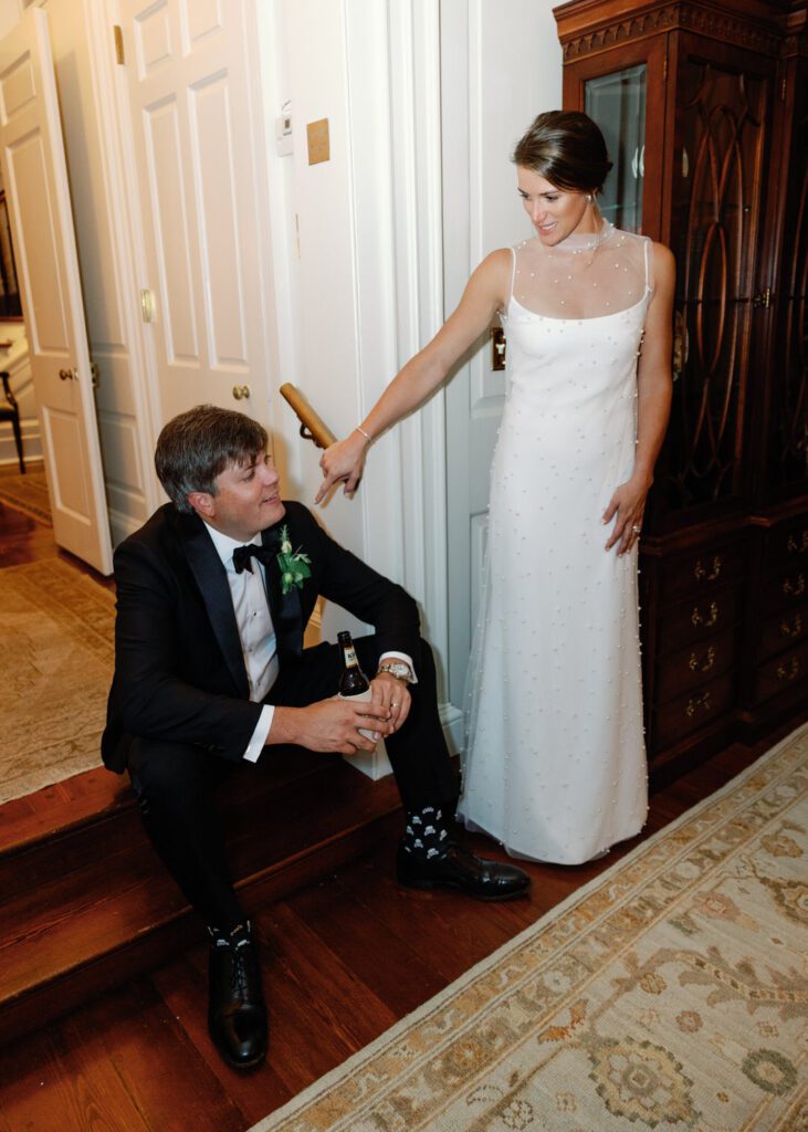 bride and groom in hallway 