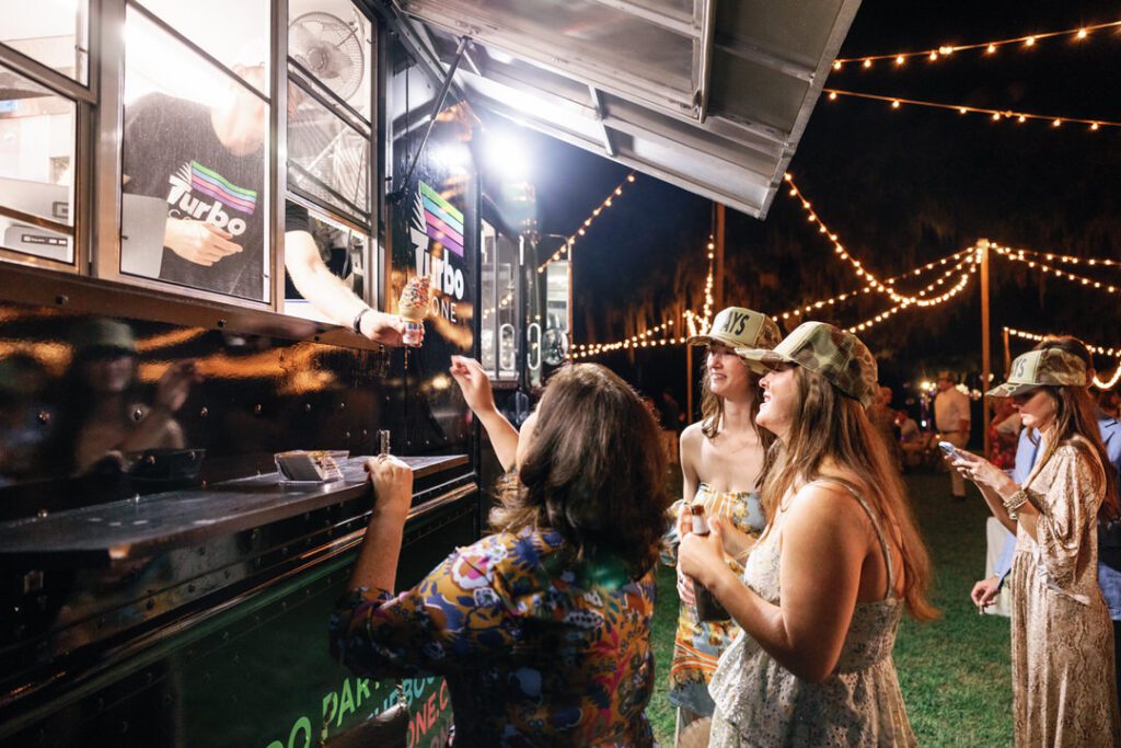 wedding guests getting ice cream from ice cream truck 