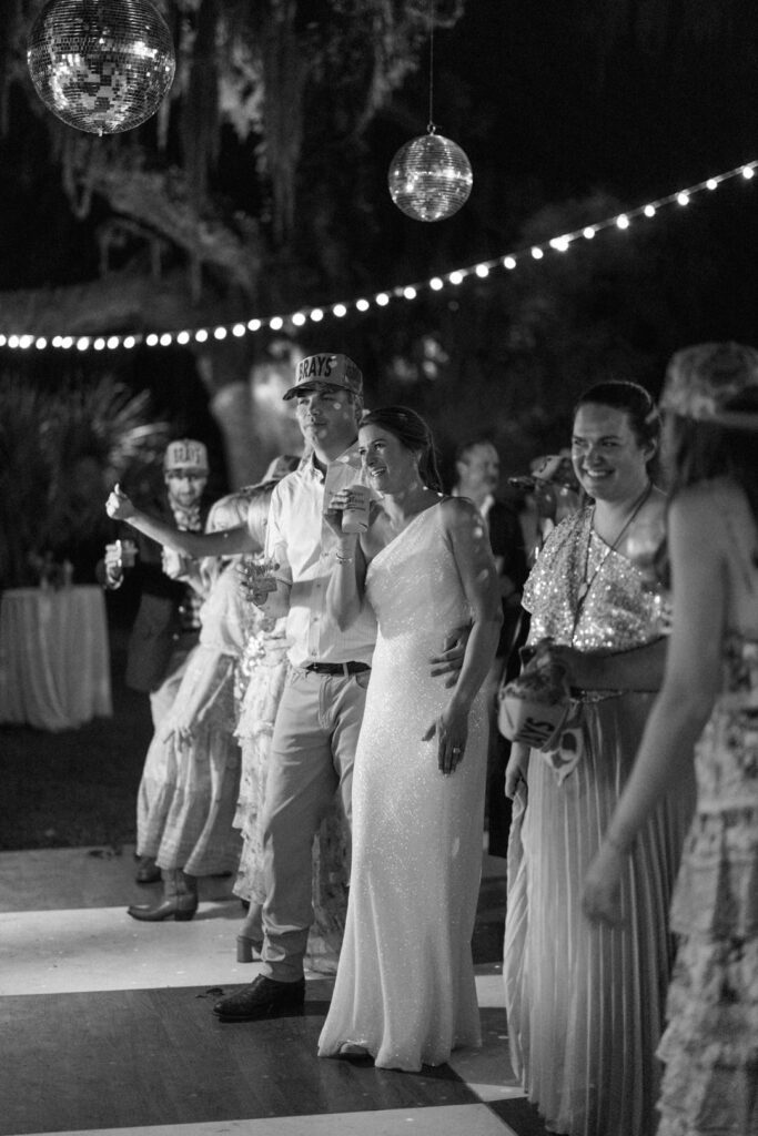 black and white of bride and groom on dance floor 