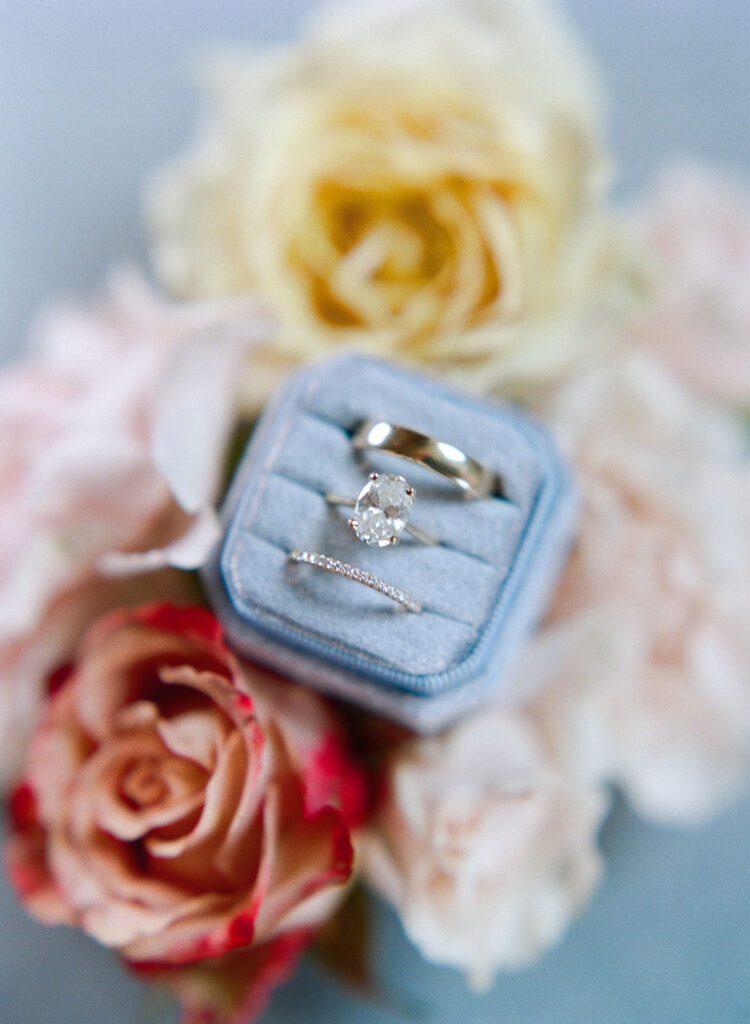 Wedding rings in a ring box with flowers