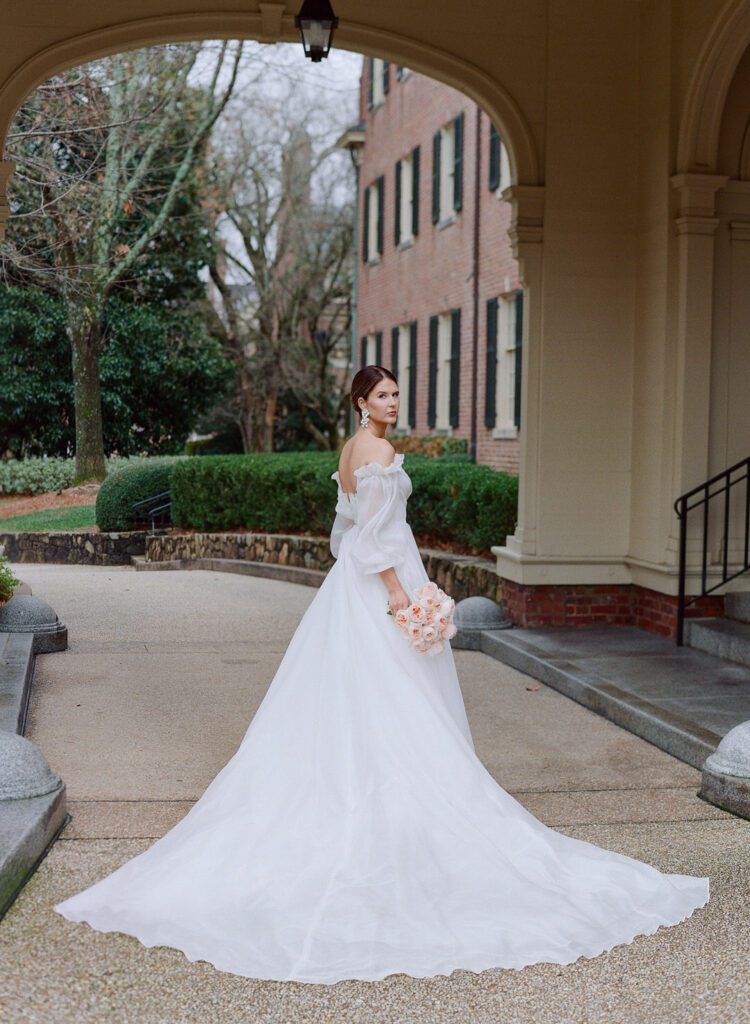 Bride under breezeway at The Carolina Inn