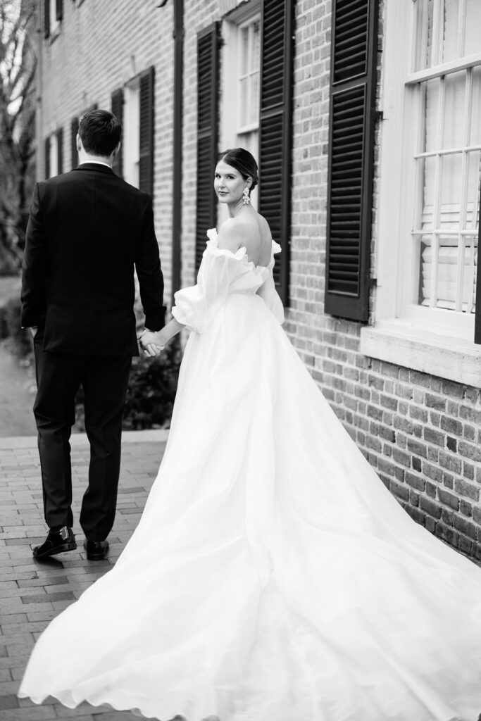 Black and White of Bride and Groom Walking at The Carolina Inn