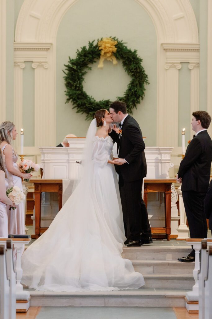 Bride and groom first kiss at ceremony