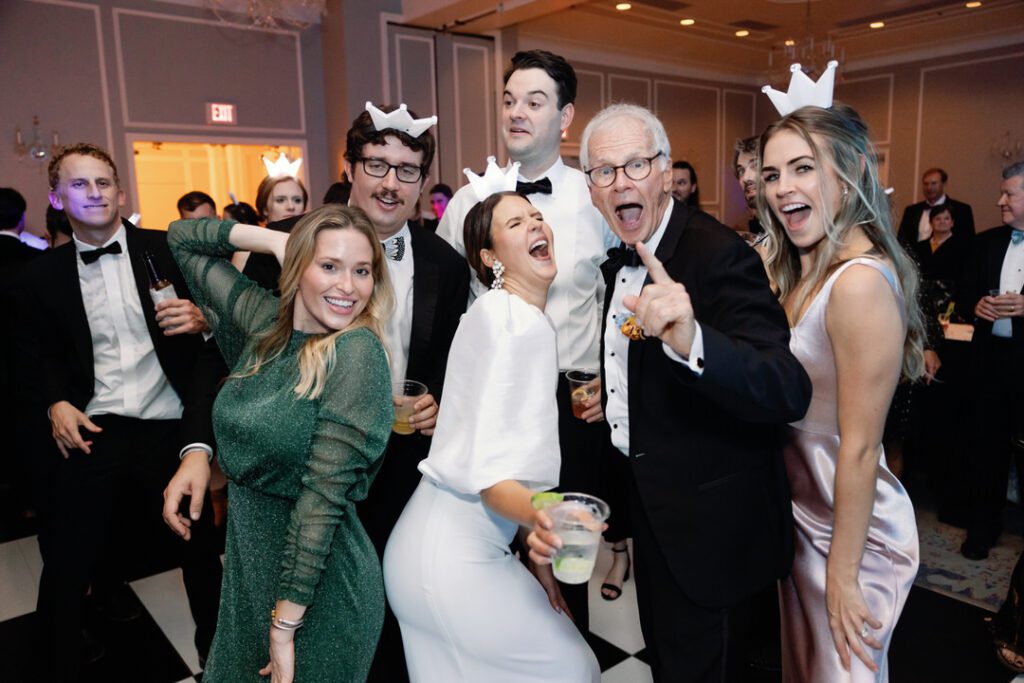 Bride with dad and guests dancing