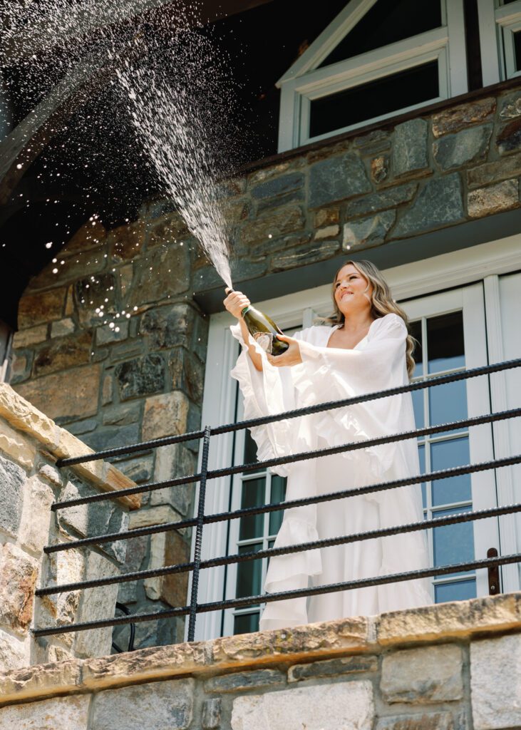 bride popping champagne