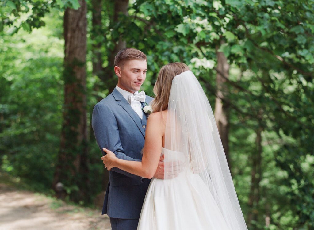 bride and groom hugging