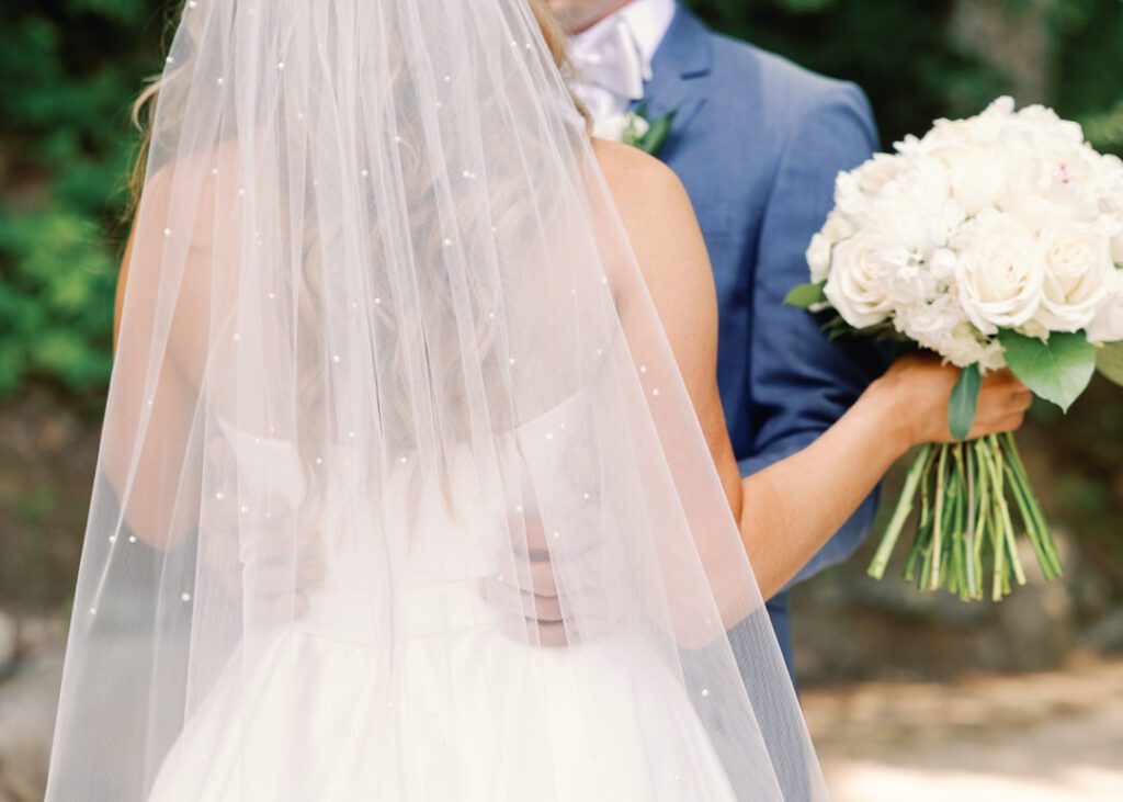 bride and groom hugging