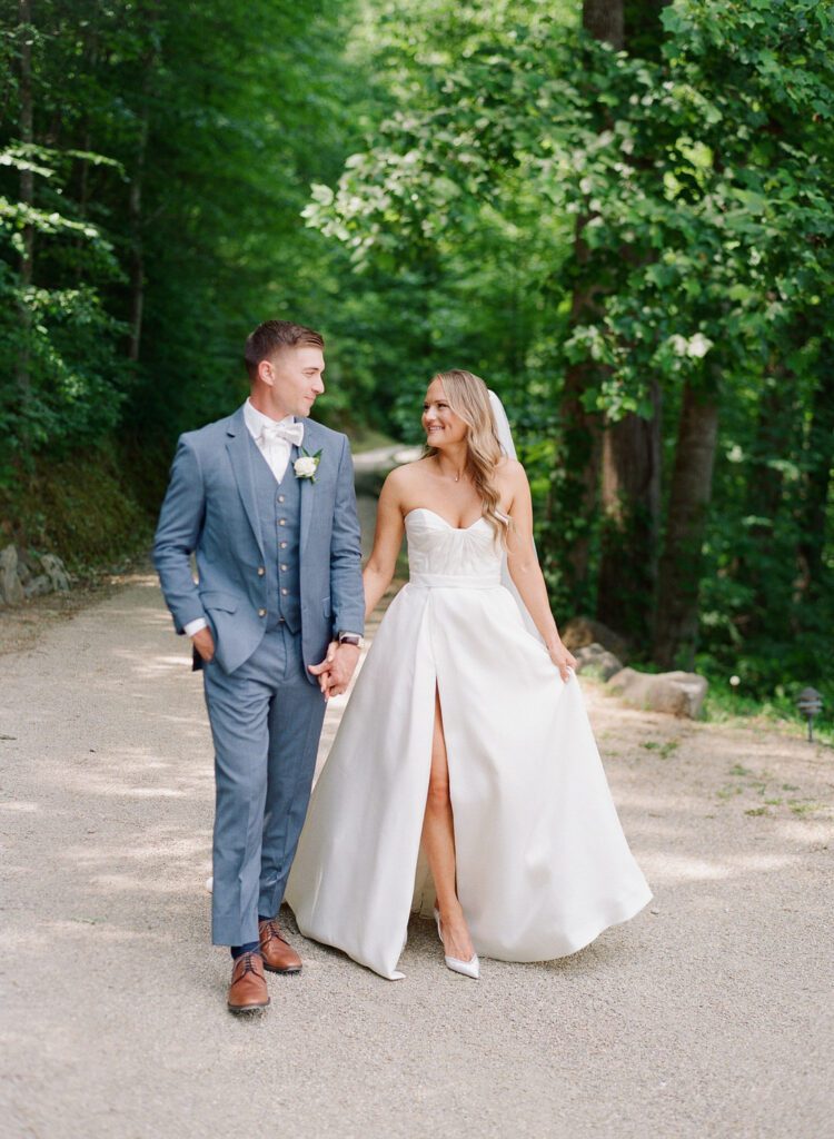 bride and groom holding hands