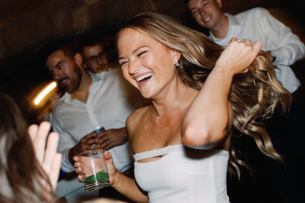 bride dancing and laughing