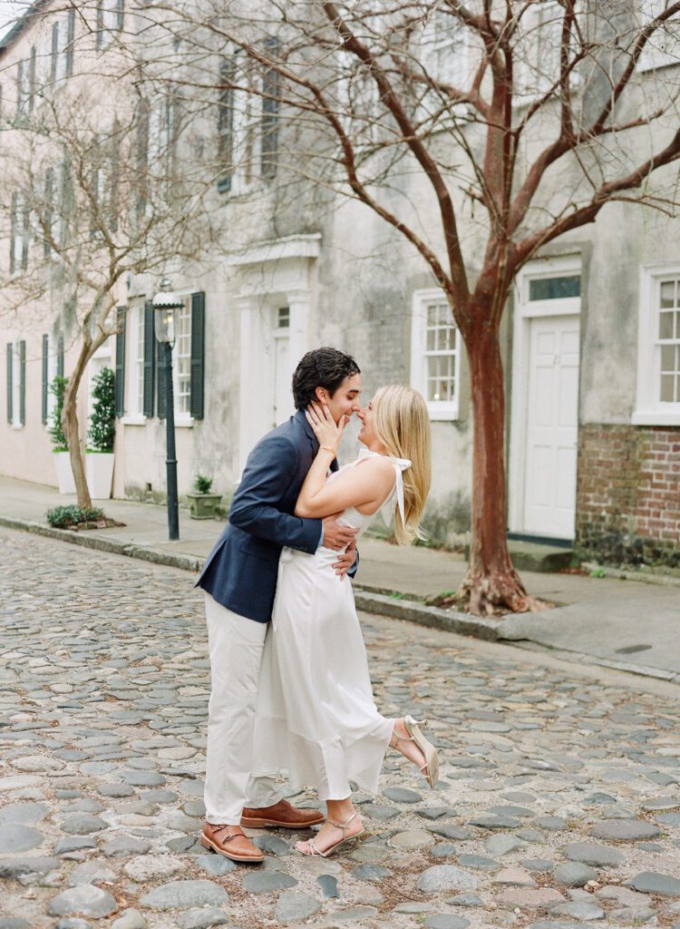 Couple Nose to nose on Chalmers Street for their Charleston Engagement Photos