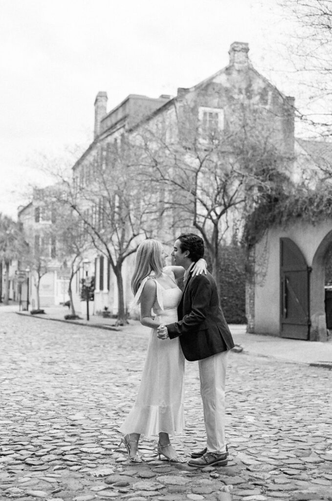 black and white photo of the couple hugging