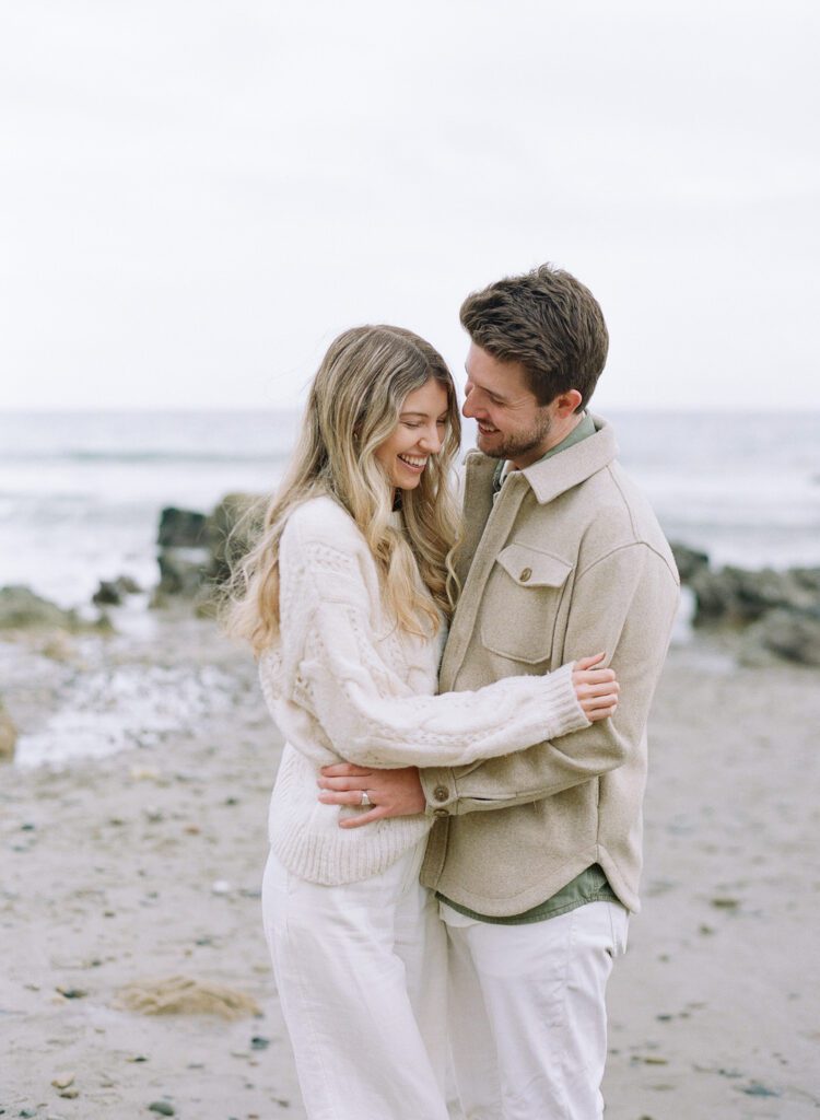 couple laughing and hugging