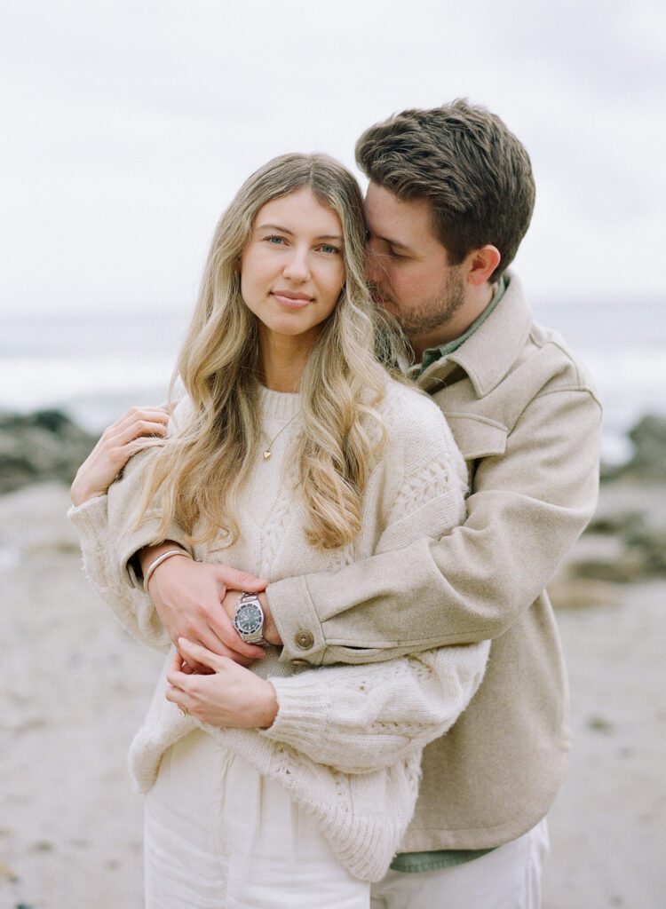 couple hugging on beach