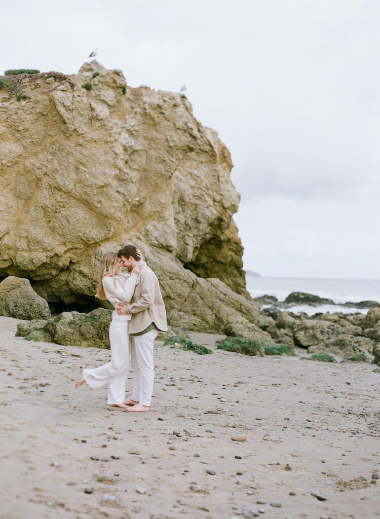 Couple Snuggling on the beach