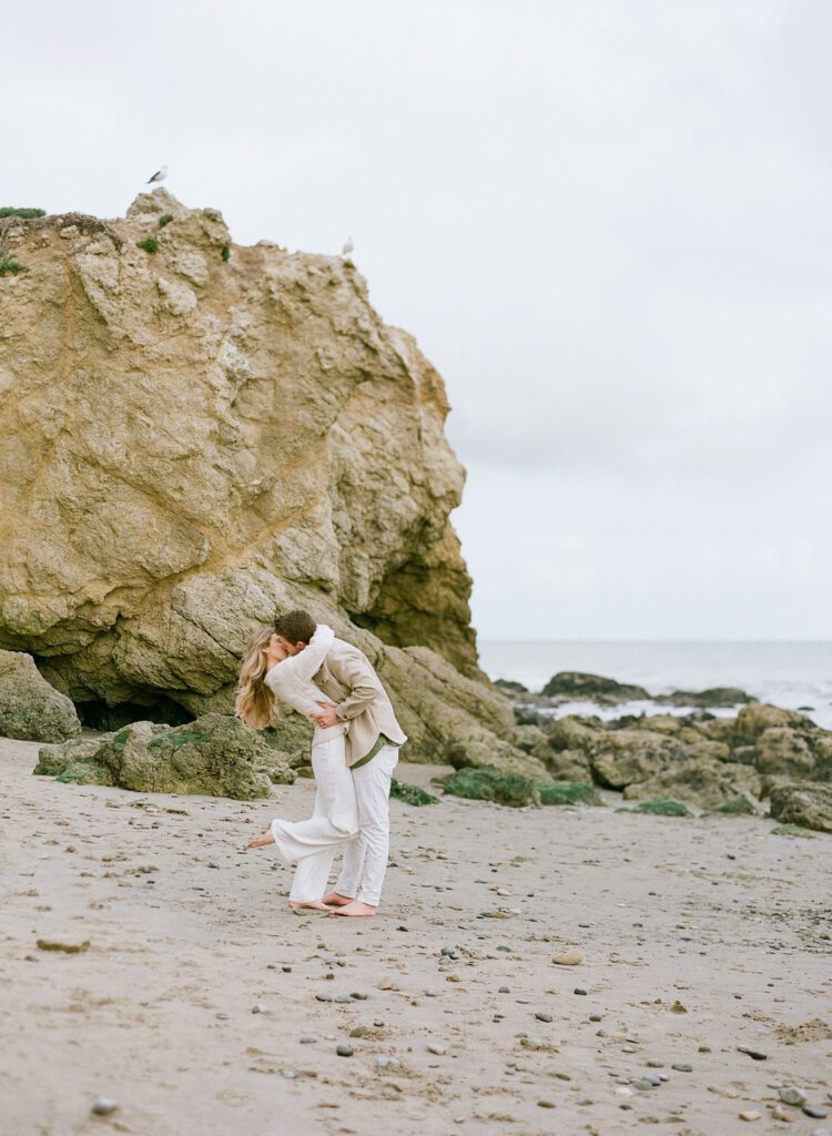 Couple kissing on the beach