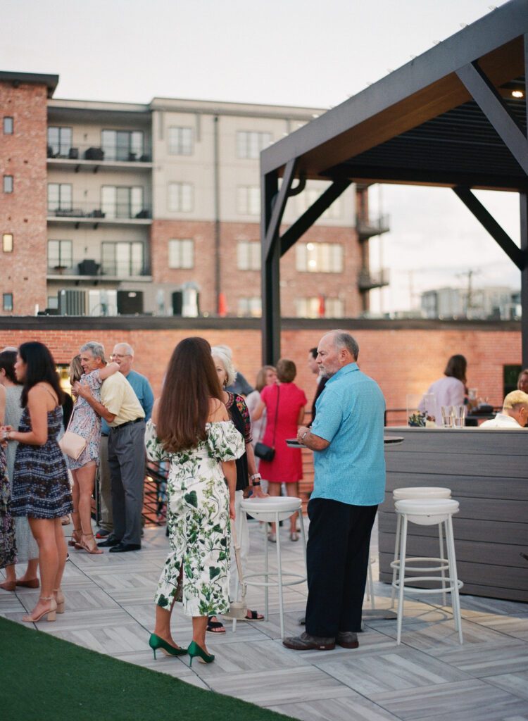 mingling on roof rehearsal dinner