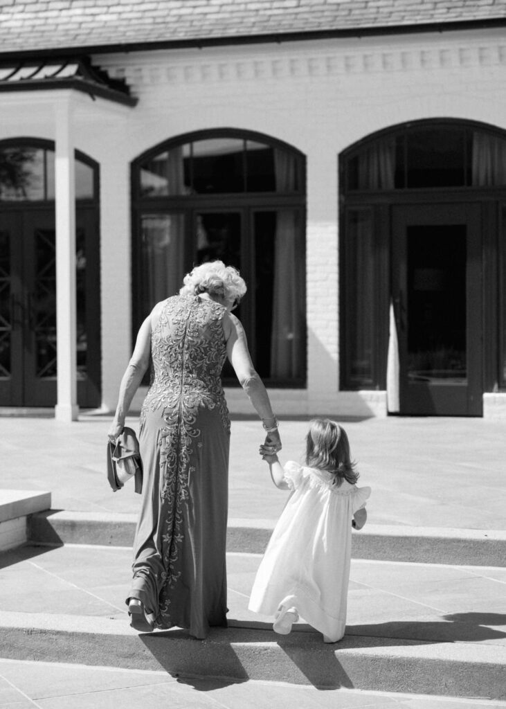 black and white of grandma and flower girl 