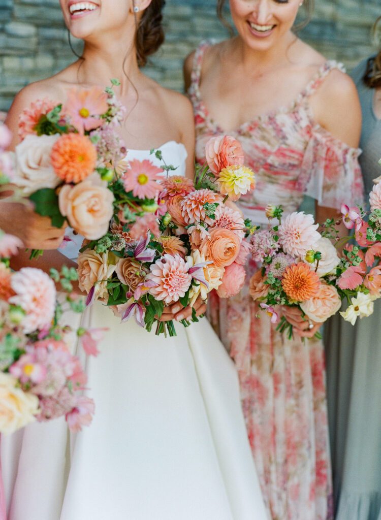 bride and bridesmaids holding bouquets 