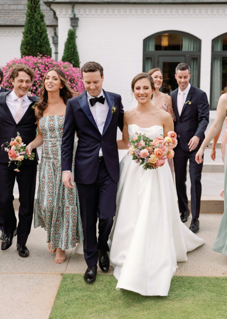 bride and groom with wedding party 