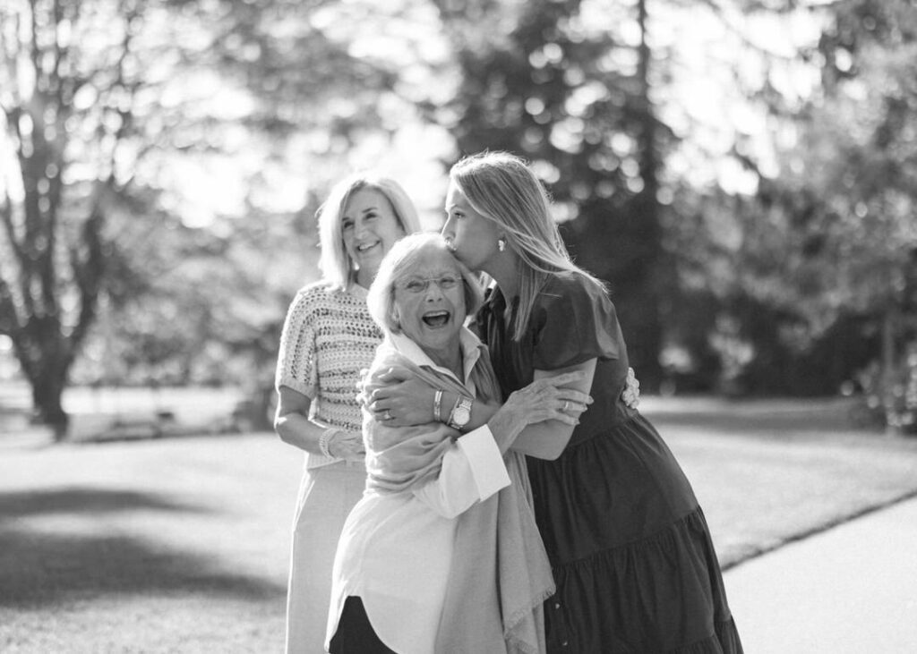 black and white of bride kissing grandma