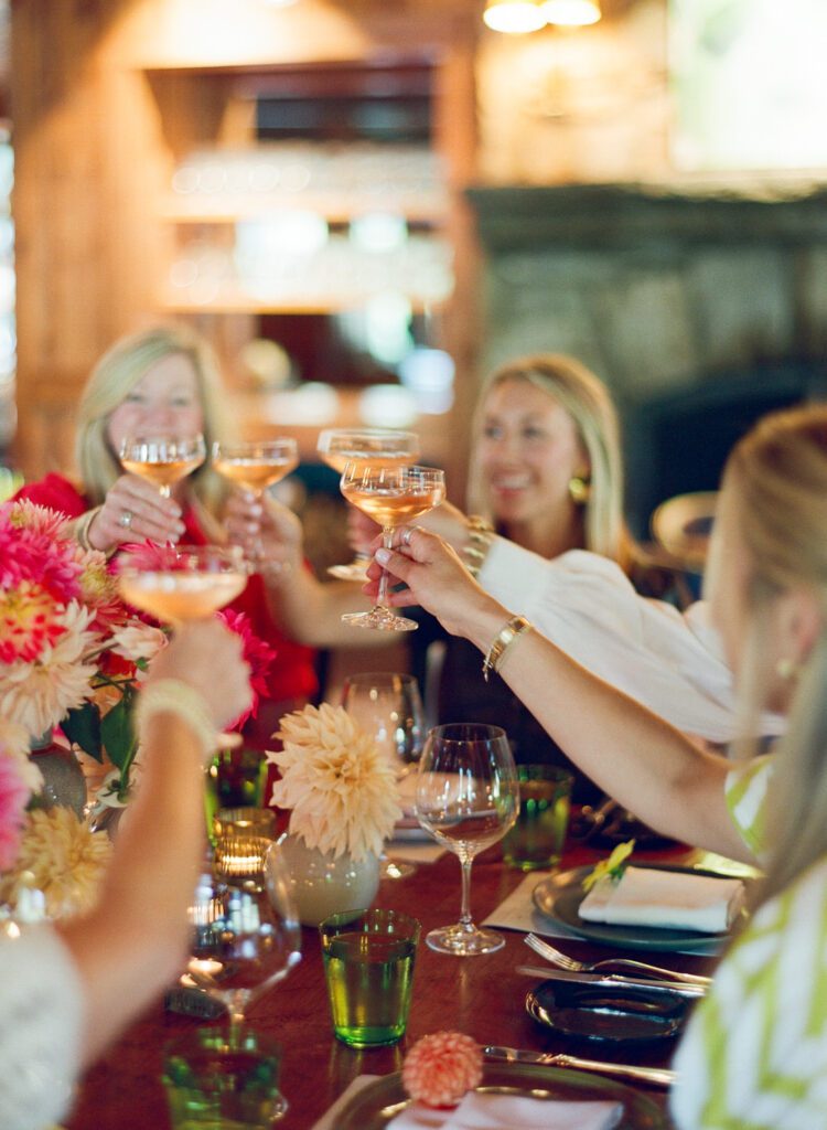 table of ladies toasting with champagne