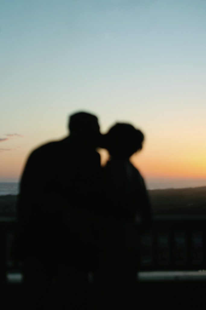 bride and groom kissing blur