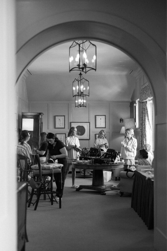 black and white of bridesmaids getting ready in bridal suite at Cassique at Kiawah Island River Course