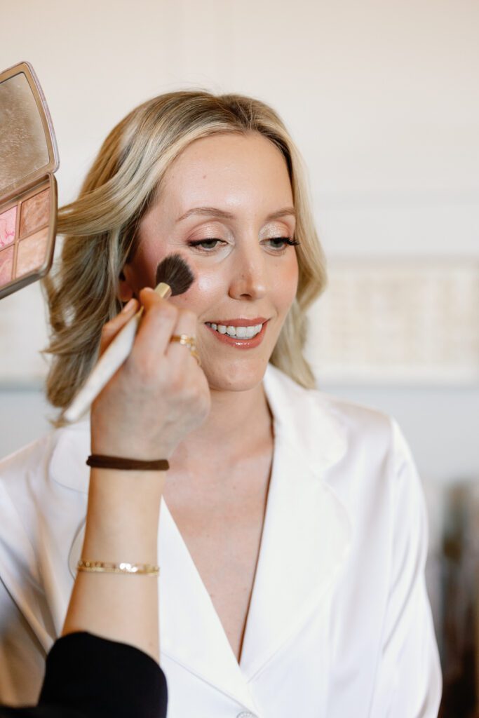 bride getting makeup done