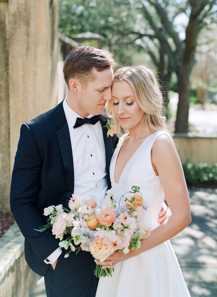 bride and groom snuggling