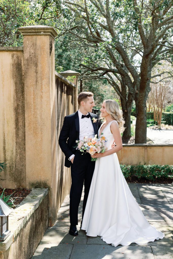 bride and groom smiling at each other