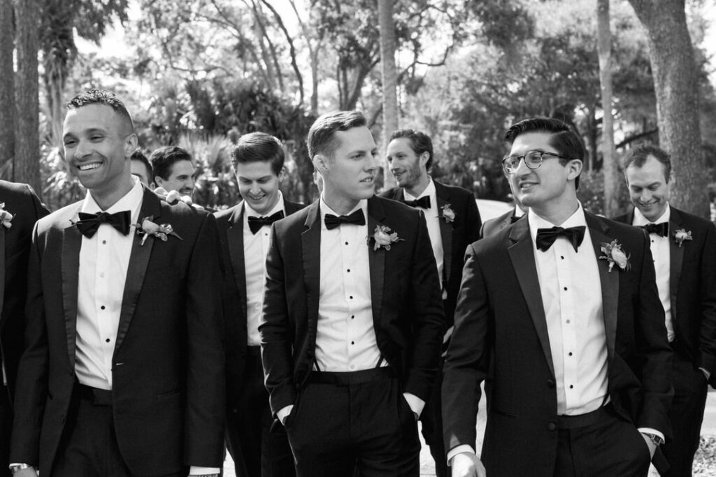 black and white of groom with groomsmen