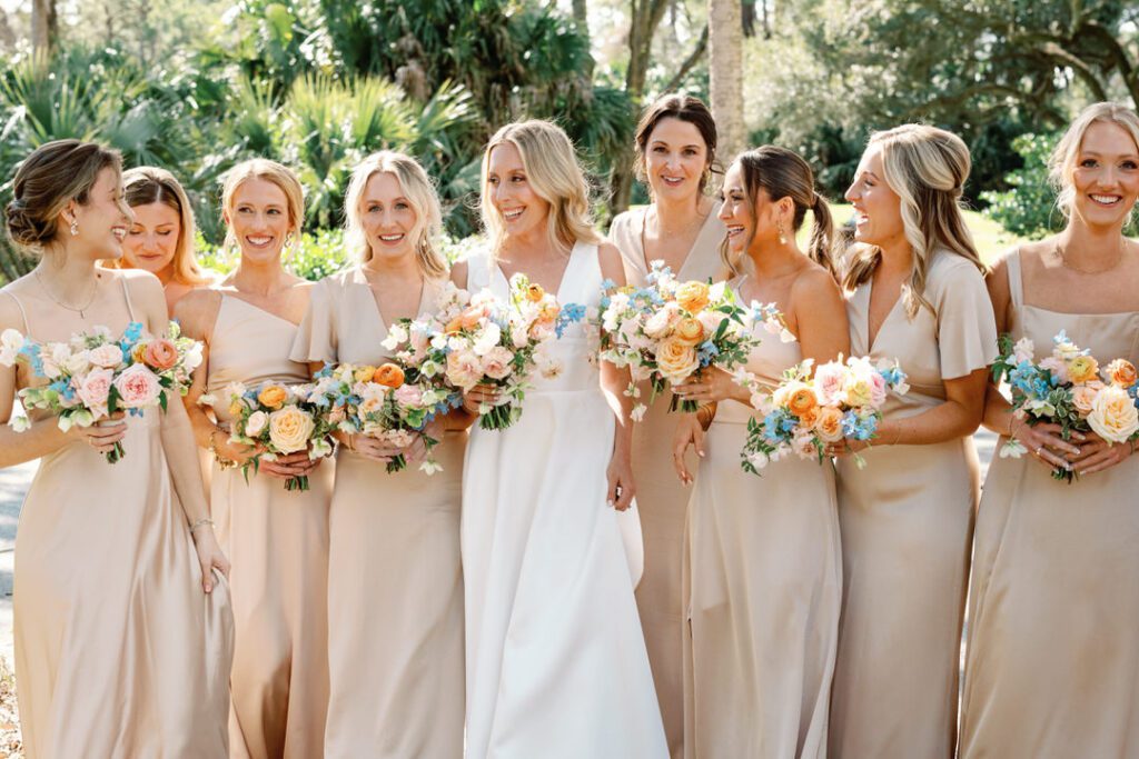 bride laughing with bridesmaids