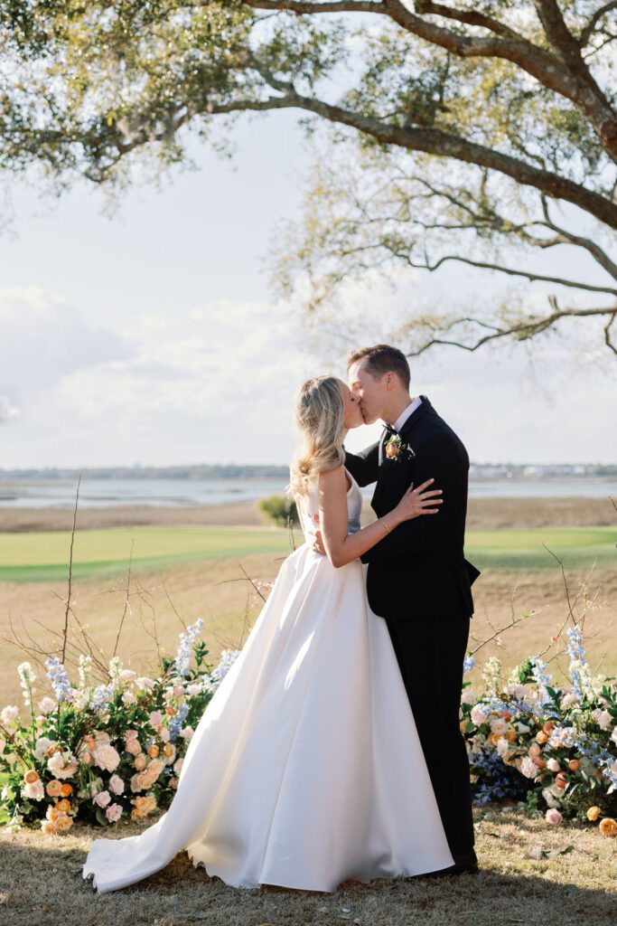 bride and groom first kiss