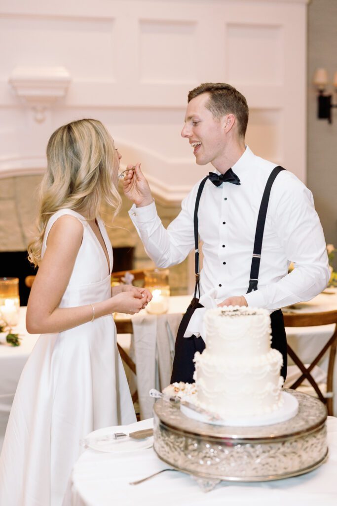 bride and groom eating cake