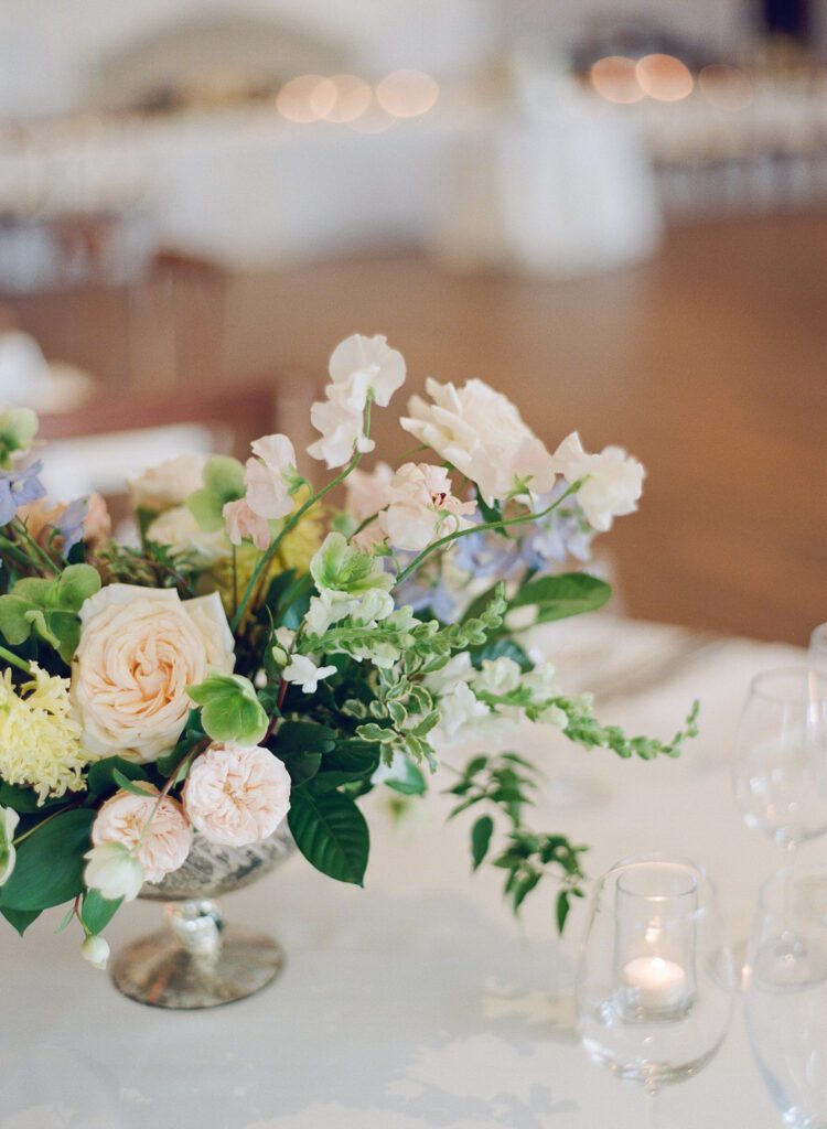 wedding reception table with flowers and candles