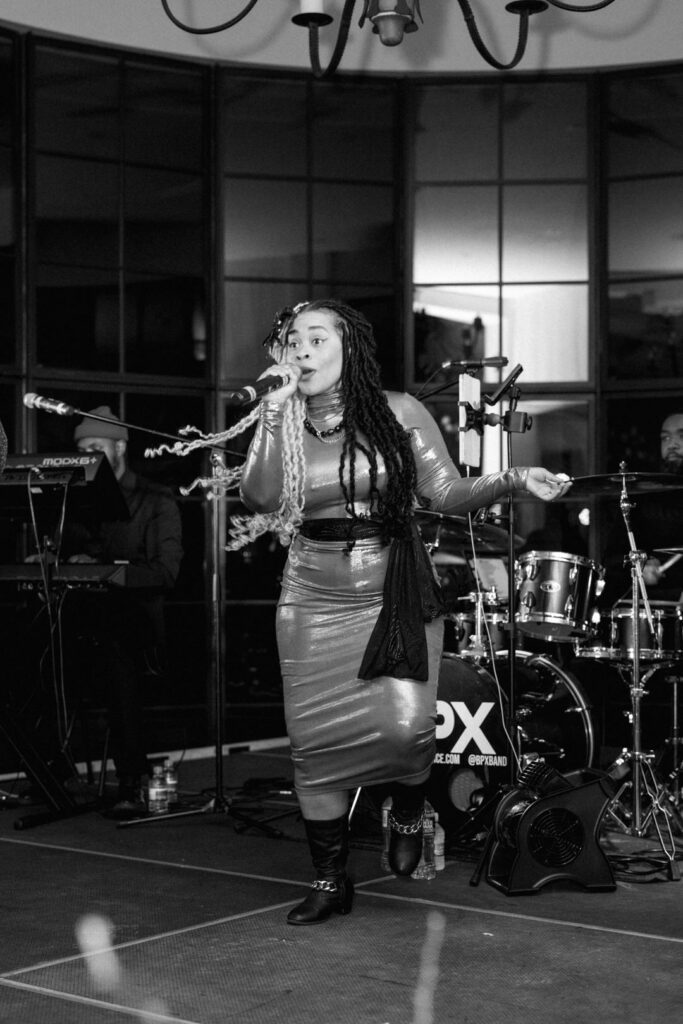 black and white of girl singing