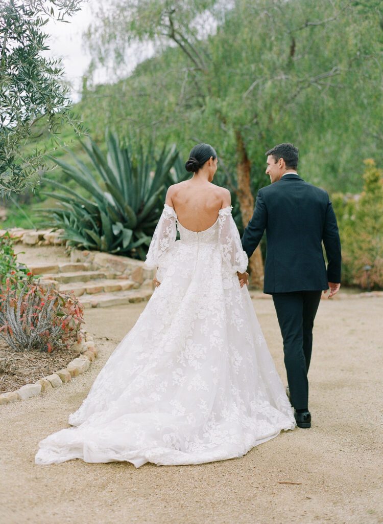 Bride and Groom Holding Hands 