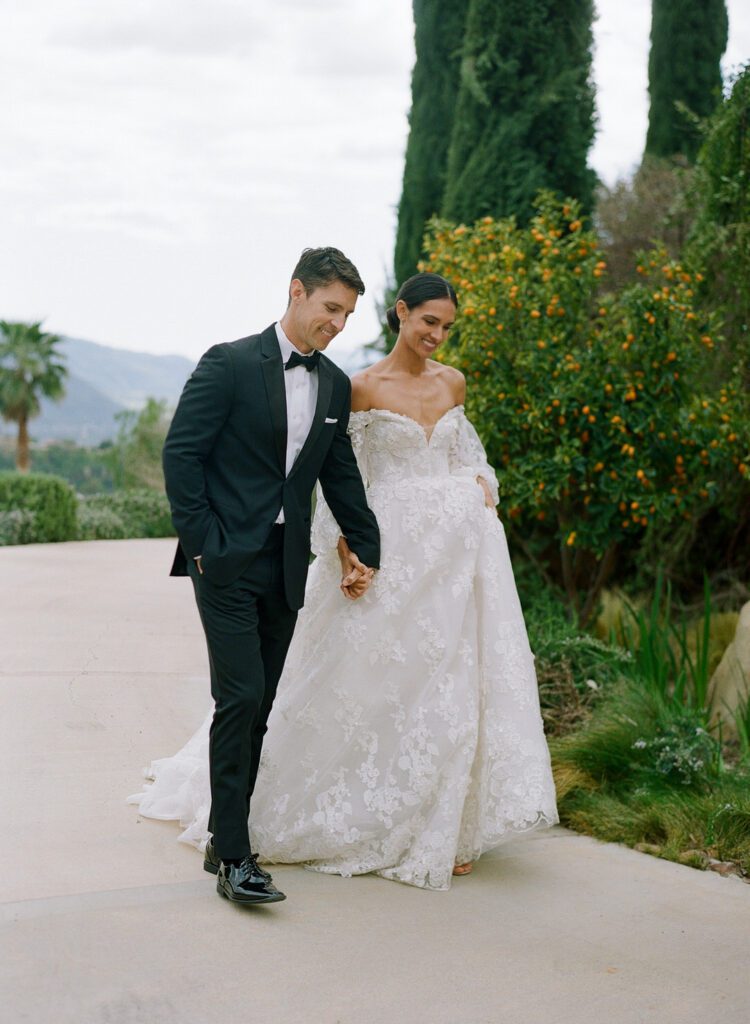 Bride and Groom Holding Hands Walking 