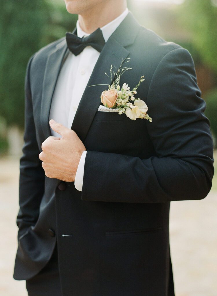 Groom Holding Jacket 